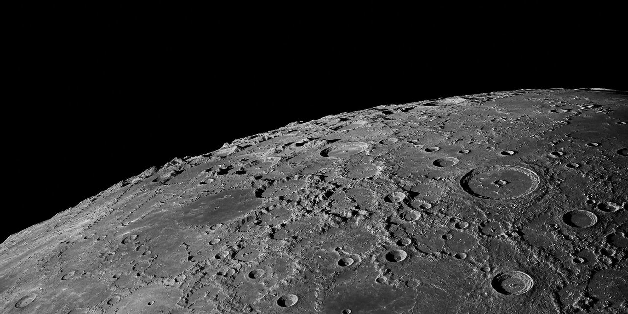 Craters and mountain shadows along the lunar terminator